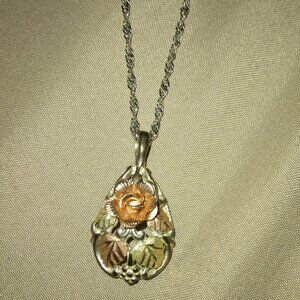 Rose with leaf pendant necklace.